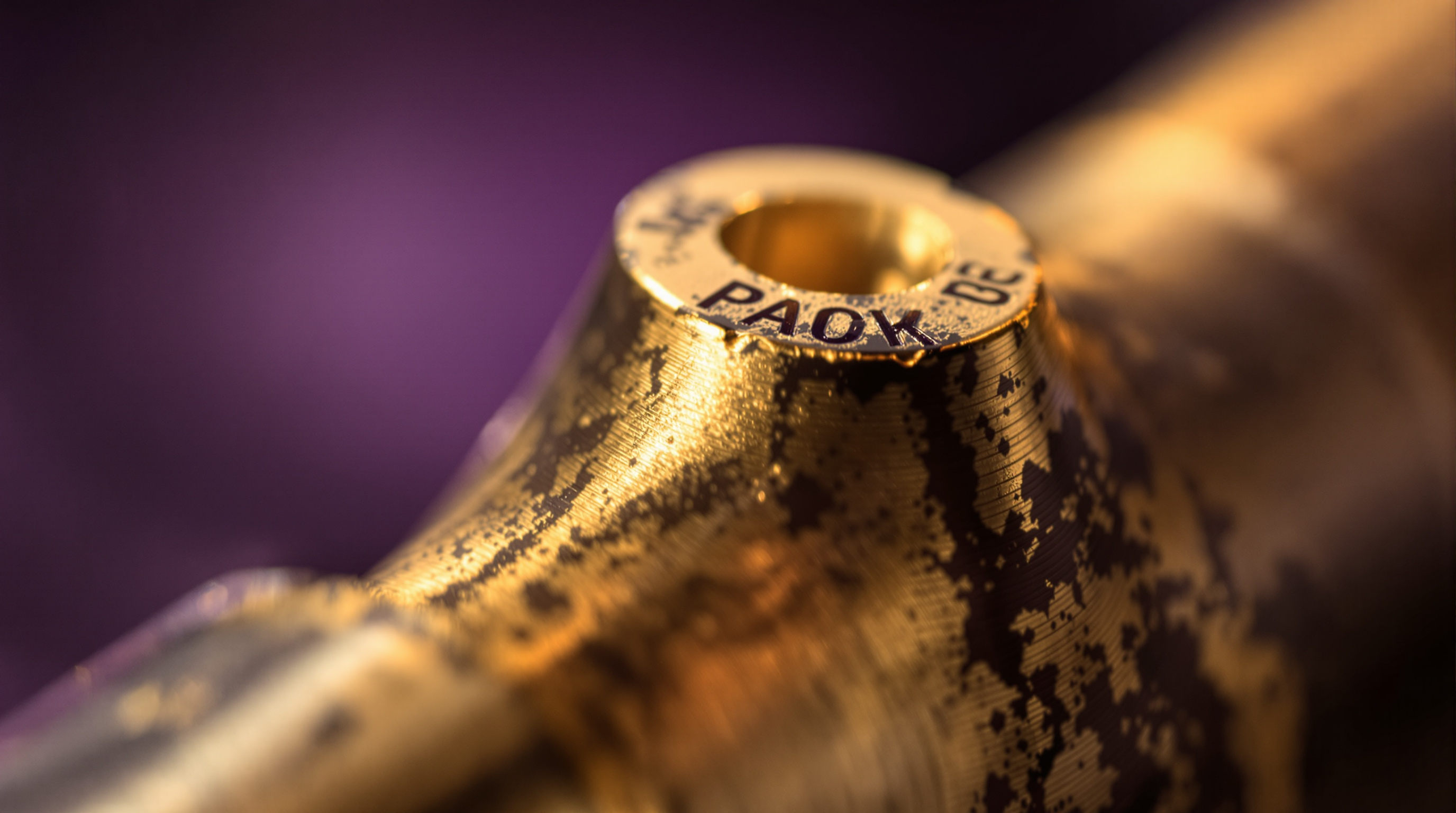 Close-up of an exposed brass joint at a chair bracket